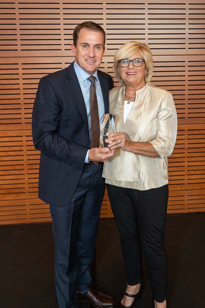 Kathy presents Greg Longstreet, CEO of Del Monte Foods, with the 2024 Corporate Hero Award at the America’s Healthiest Schools Leaders Summit.